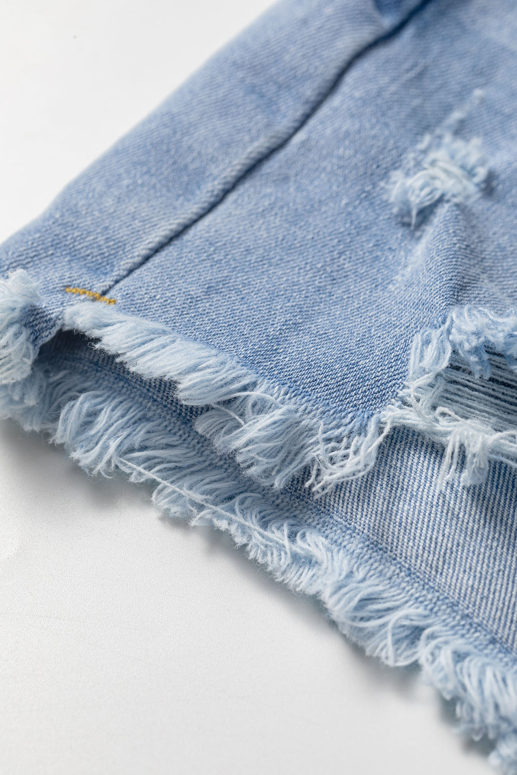 *Beau Blue Asymmetric Raw Hem Distressed Whiskery Denim Shorts